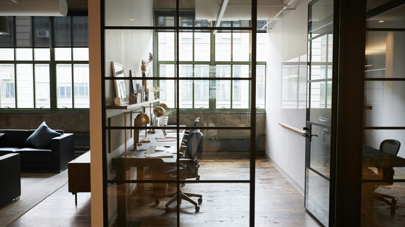 Empty glass walled office booth in a business place