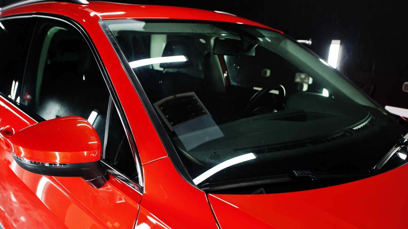 Nice and new orange sport suv car in modern garage.